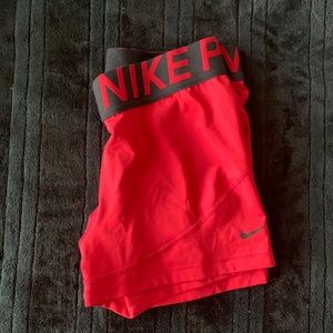Red Nike pro shorts